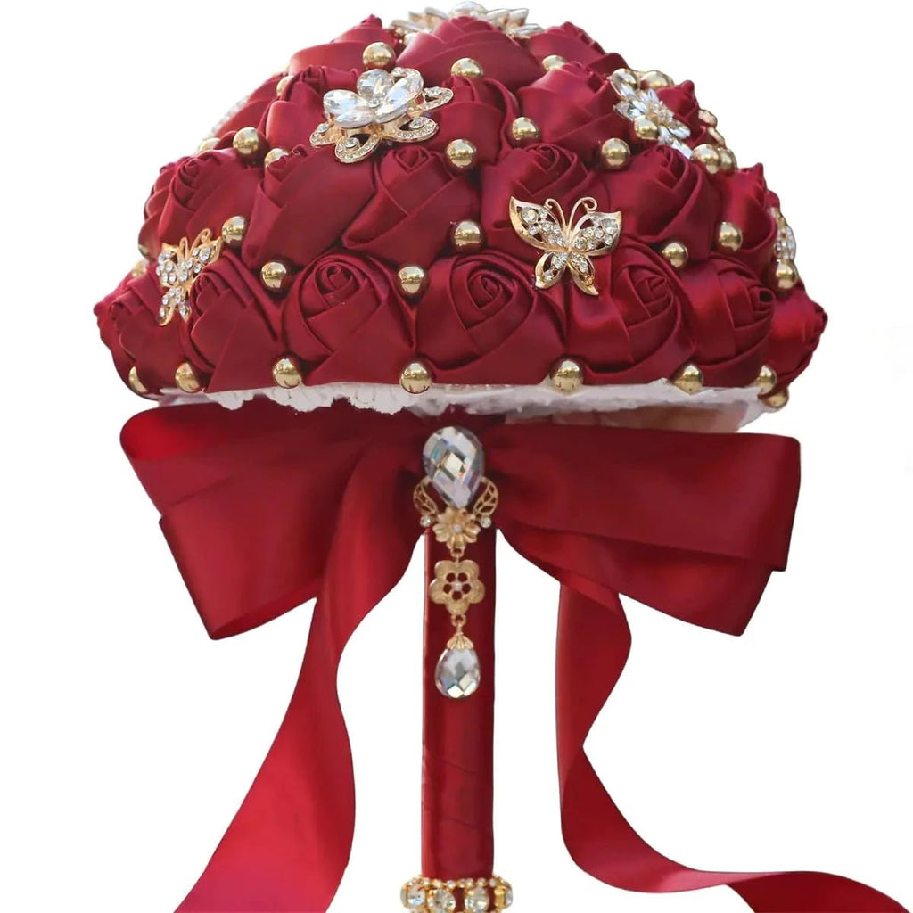 Dark red Eternal Rose bridal bouquet by MANDOTOS INTERNATIONAL, featuring preserved roses arranged in a romantic floral display.