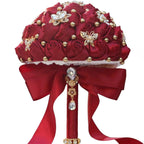 Dark red Eternal Rose bridal bouquet by MANDOTOS INTERNATIONAL, featuring preserved roses arranged in a romantic floral display.