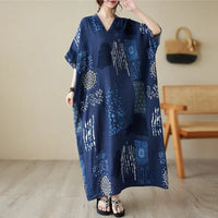 Casual ethnic bohemian beach dress for women by MANDOTOS INTERNATIONAL, featuring flowing fabric and vibrant patterns.