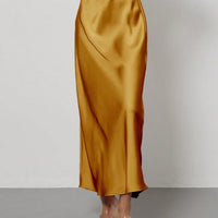 European American style satin midi skirt by MANDOTOS INTERNATIONAL, shown in a sleek, flowing design perfect for elegant fashion.