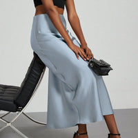 European American style satin midi skirt by MANDOTOS INTERNATIONAL, showcasing a sleek, elegant design with a smooth satin finish.