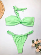 Mandotos International eco-friendly women's one-shoulder bikini set with split design, made from recycled fabric, suitable for stylish swimwear.