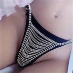 High-quality women's crystal thong panties with rhinestones and shiny bikini chain jewelry, part of lingerie set by MANDOTOS INTERNATIONAL.