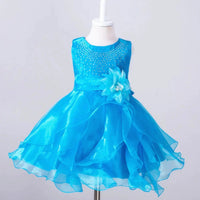 Kids glam dresses and gowns by MANDOTOS INTERNATIONAL, featuring colorful, sparkly designs perfect for special occasions.