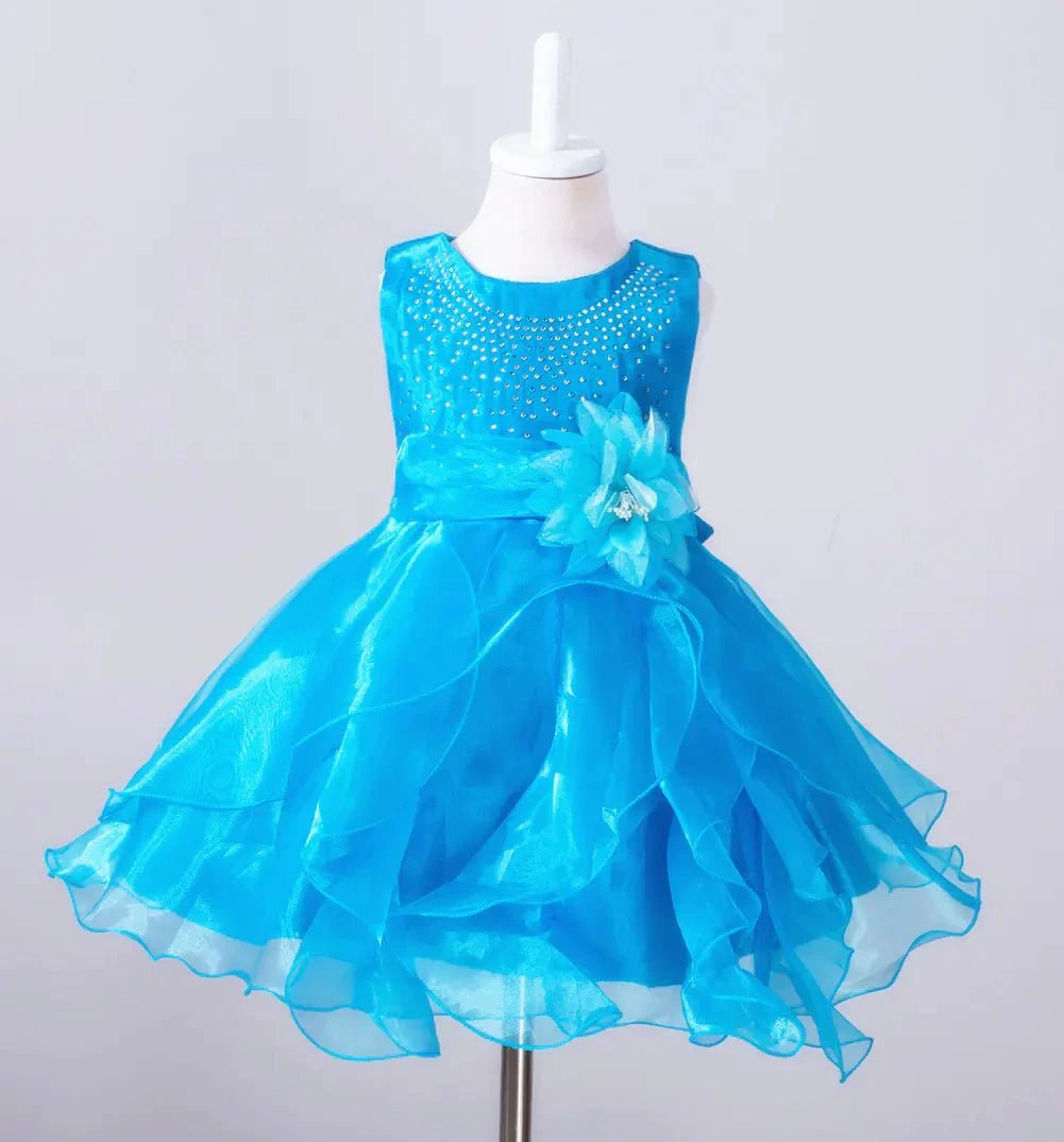 Kids glam dresses and gowns by MANDOTOS INTERNATIONAL, featuring colorful, sparkly designs perfect for special occasions.