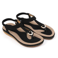 Ladies' chic beach flip flops by MANDOTOS INTERNATIONAL, featuring stylish straps and comfortable soles for warm weather.