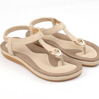 Ladies' chic beach flip flops by MANDOTOS INTERNATIONAL with stylish straps and comfortable soles, perfect for summer days.