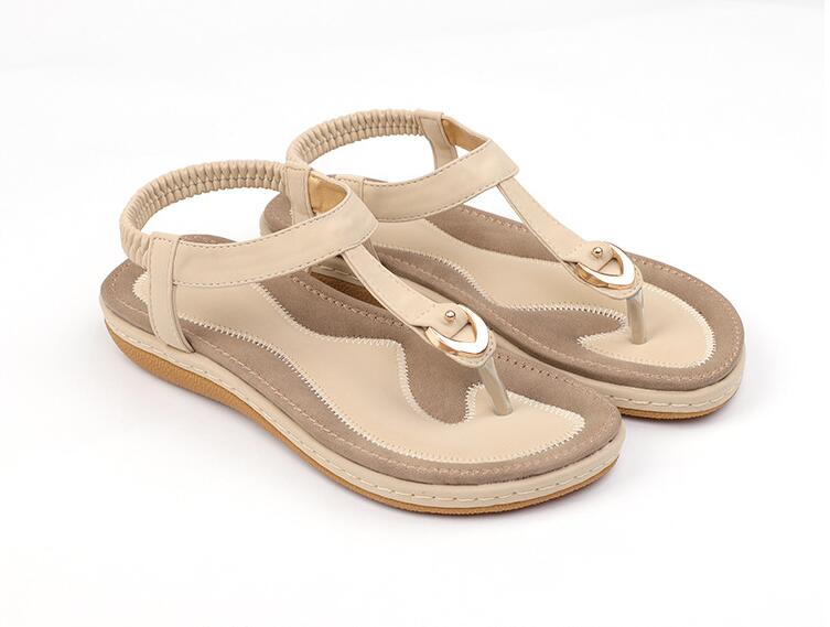 Ladies' chic beach flip flops by MANDOTOS INTERNATIONAL with stylish straps and comfortable soles, perfect for summer days.