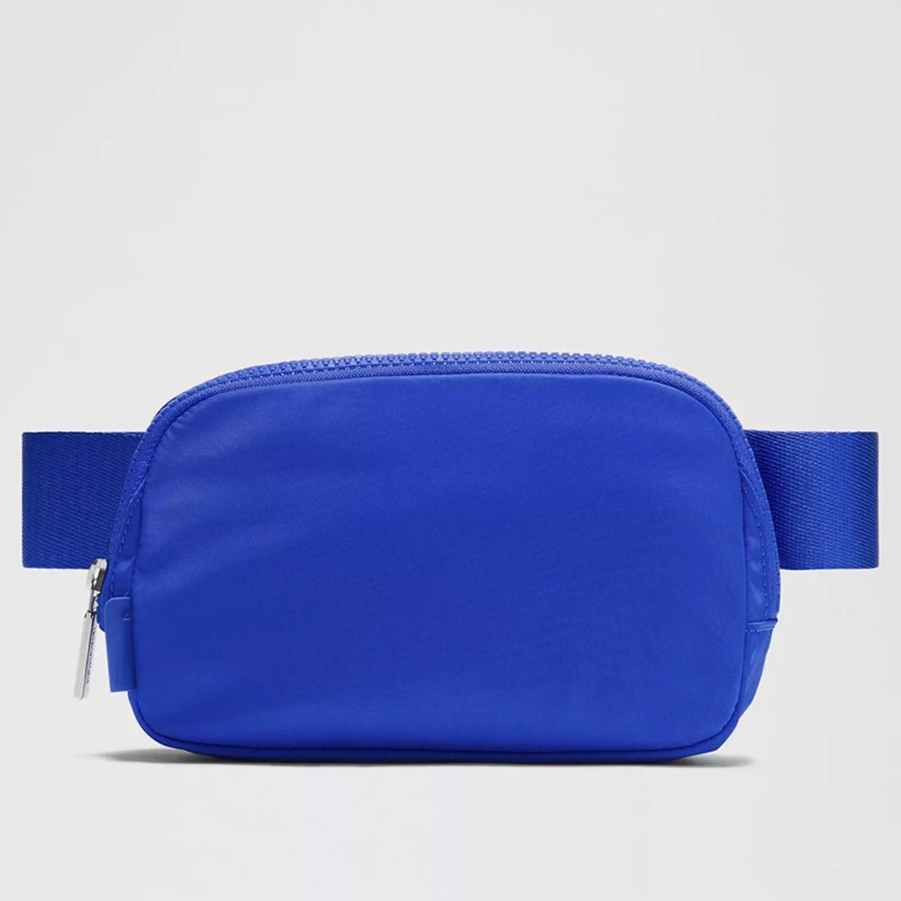 Mandotos International lightweight women's waist bag for running and travel, shown in black, with adjustable strap and compact design.