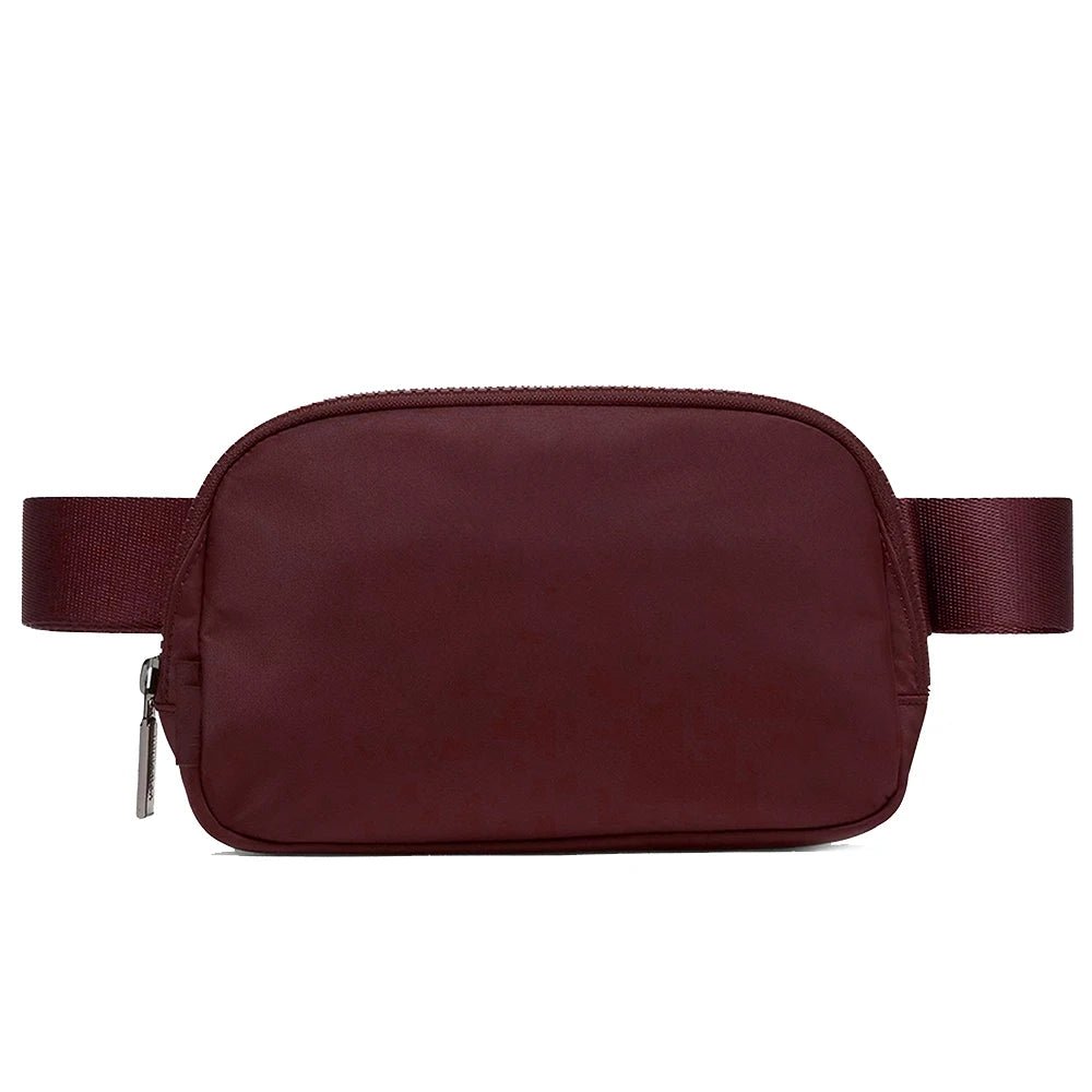 Mandotos International lightweight women's waist bag for running and travel, with adjustable strap and secure zip closure.