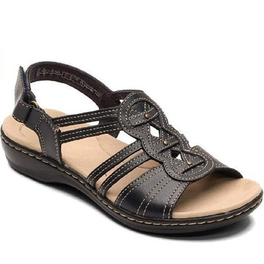Trendy women's beach sandals by MANDOTOS INTERNATIONAL featuring stylish straps and comfortable sole for summer wear.