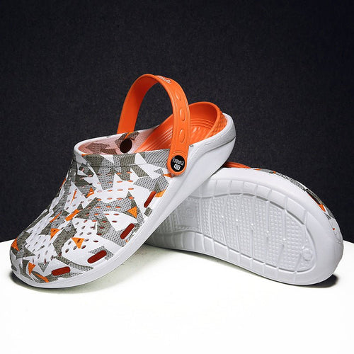 Unisex beach and outdoor slippers by MANDOTOS INTERNATIONAL, showing comfortable slip-on sandals with a casual design for outdoor wear.