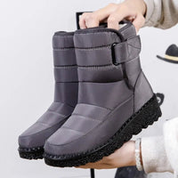 Women's waterproof winter snow boots by MANDOTOS INTERNATIONAL with non-slip soles, warm lining, and stylish ankle platform design.