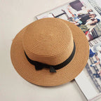 Mandotos Island Breeze Boater hat with wide brim, lightweight straw material, and decorative ribbon for sun protection and style