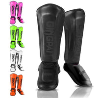 Mandotos kickboxing shin guards for Muay Thai, padded leg protectors designed for martial arts training and impact defense.