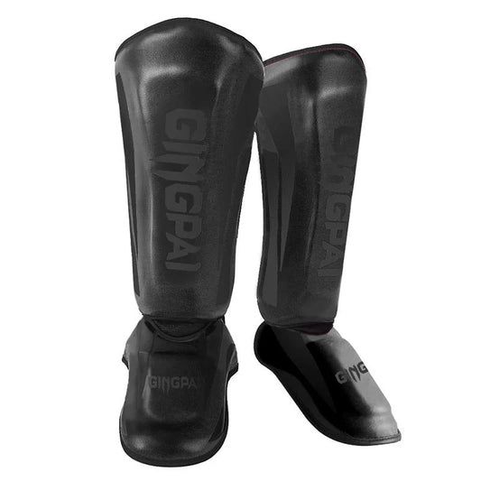 Mandotos kickboxing shin guards and Muay Thai leg protectors shown on a model, providing safety and support during training.