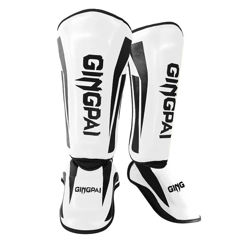 Mandotos kickboxing shin guards and Muay Thai leg protectors, padded for impact, designed for martial arts training and sparring.