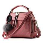 Elegant ladies' luxury leather handbag by MANDOTOS with sleek design, top handle, and refined craftsmanship.