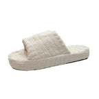 Comfortable ladies' plush slip-on slippers by MANDOTOS, featuring soft fabric and cozy design for indoor wear.