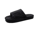 Soft pink ladies' plush slip-on slippers by MANDOTOS with cozy fleece lining and a non-slip sole for comfortable indoor wear.