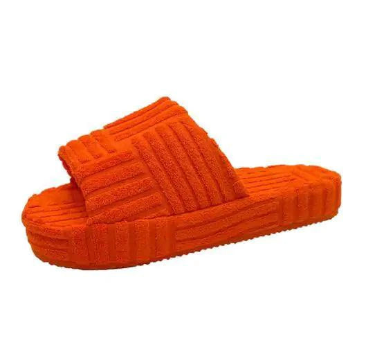 Comfortable ladies' plush slip-on slippers by MANDOTOS with soft lining and cozy design for indoor wear.