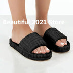 Comfortable ladies' plush slip-on slippers by MANDOTOS with soft, cozy fabric for indoor wear.