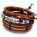 Layered leather charm bracelet by MANDOTOS with metal and bead accents, styled with multiple leather straps.