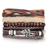 Layered leather charm bracelet by MANDOTOS featuring multiple leather straps and metal charms for a stylish accessory.