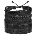 Layered leather charm bracelet by MANDOTOS featuring multiple leather strands and metal charms on a neutral background.