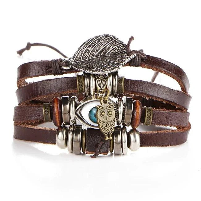 Layered leather charm bracelet by MANDOTOS featuring multiple leather strands and decorative metal charms.
