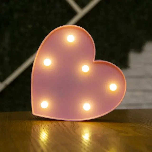 Mandotos luminous letter lights spelling out "LOVE" on a wall, decorative LED signs for home decor and ambiance.