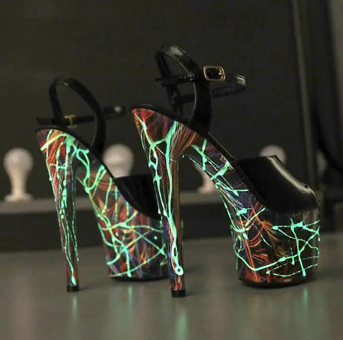 Pair of lustrous leather stilettos by MANDOTOS featuring sleek design and shiny finish, perfect for elegant evening wear.