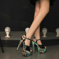 Mandotos Lustrous Leather Stilettos featuring sleek pointed toes and high heels, crafted from shiny leather.