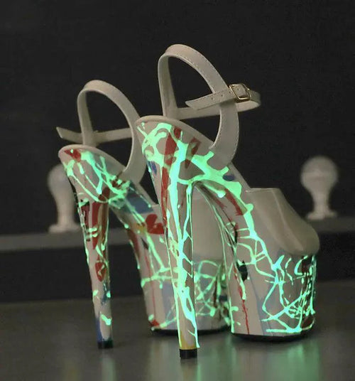 Mandotos Lustrous Leather Stilettos featuring pointed toes, slim heels, and shiny leather finish on a neutral background.