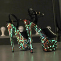 Mandotos lustrous leather stilettos with pointed toes and sleek heel, perfect for elegant evening wear.