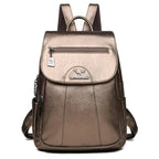 Luxury embossed leather backpack by MANDOTOS with sleek design and textured finish, featuring adjustable straps and top handle.
