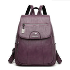 Mandotos luxury embossed leather backpack with stylish design, top handle, and adjustable straps on a neutral background.