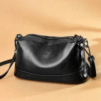Luxury genuine leather handbag by MANDOTOS featuring sleek design and elegant craftsmanship.