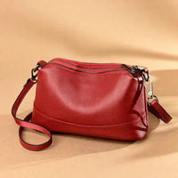 Mandotos luxury genuine leather handbag with sleek design, featuring sturdy handles and elegant craftsmanship.