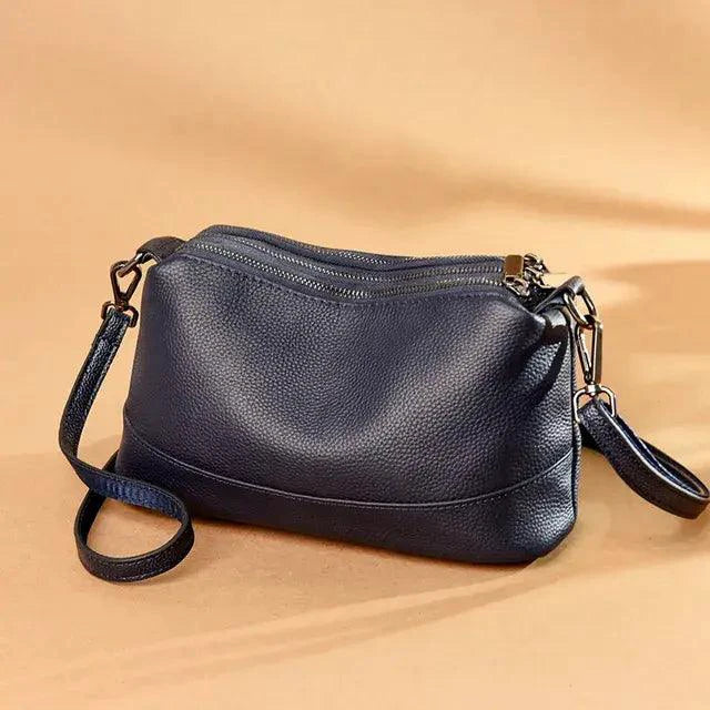 Mandotos luxury genuine leather handbag with sleek design and elegant stitching, showcasing high-quality craftsmanship.