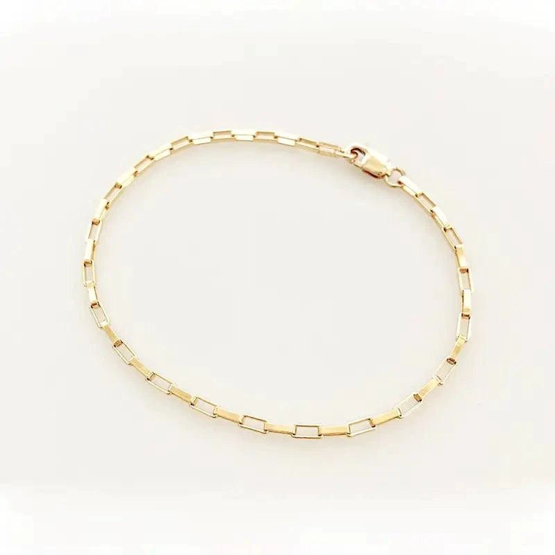 Handcrafted luxury gold chain bracelet by MANDOTOS with intricate link design and polished finish.
