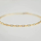 Handcrafted luxury gold chain bracelet by MANDOTOS featuring a sleek, elegant design with intricate links.
