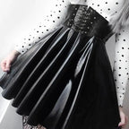 Mandotos black leather lace-up skirt with front lacing and fitted design, displayed on a mannequin.