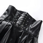 Mandotos black leather lace-up skirt with front lacing and sleek design, shown on a model.