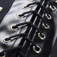 Mandotos black leather lace-up skirt with front lacing detail, fitted style, and high waist, perfect for edgy fashion looks.