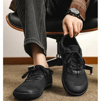 Mandotos men's breathable wide toe mesh running shoes with lightweight responsive sole for comfortable support.