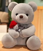 Mandotos Cuddly Rose Teddy Pillow with red rose detail and plush bear in 25, 35, or 45 cm sizes, soft and decorative.