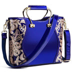 Mandotos burgundy floral leather tote bag with embroidered design and crossbody strap, featuring elegant craftsmanship and stylish detail.