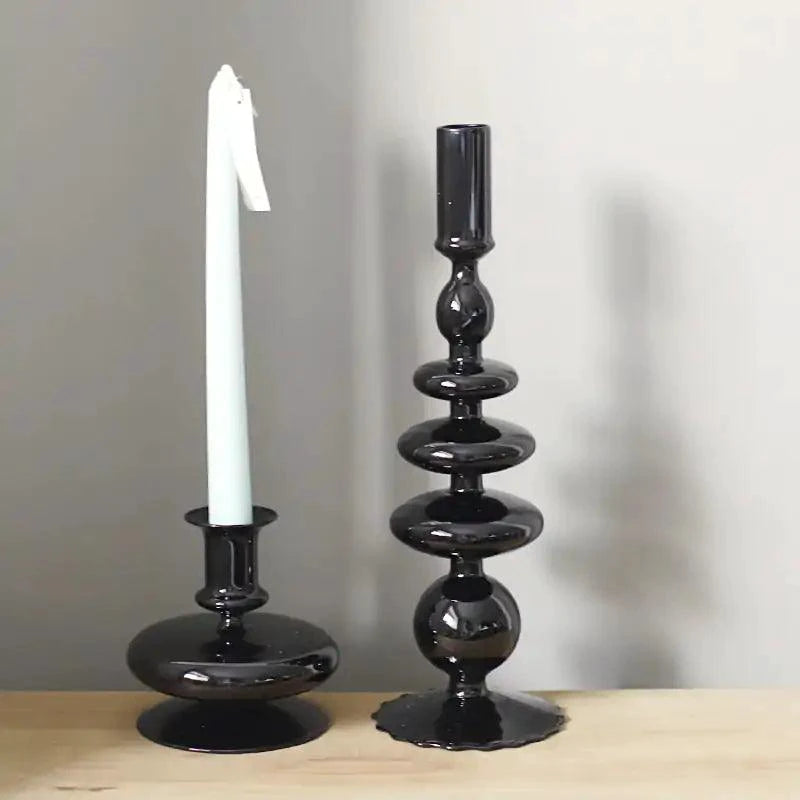 Mandotos Elegant Rue black glass candlestick holder on a table, stylish centerpiece and decor for home or gift ideas.
