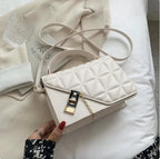 Black MANDOTOS Rhombus Pattern PU Leather Shoulder Bag, compact messenger style with zipper closure, 22x14x7 cm.